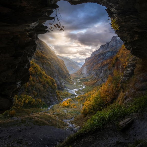 Cave Overlooking A Valley In The French Alps