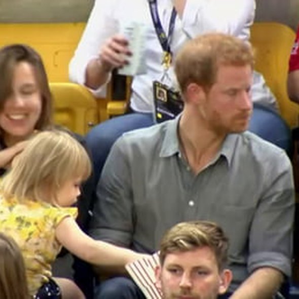 Prince Harry's popcorn swiped by a toddler..