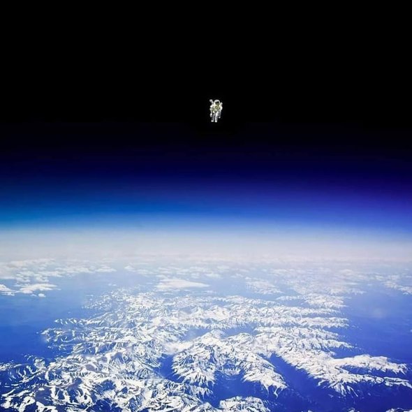 Astronaut Bruce McCandless II floating untethered away from the safety of the space shuttle.