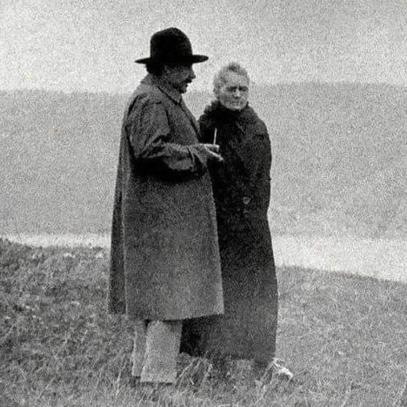 Albert Einstein and Marie Curie discussing 1929