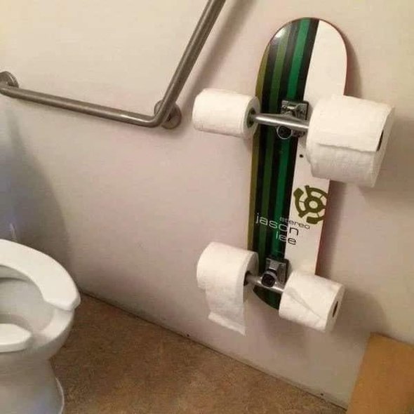 Skateboard toilet paper holder